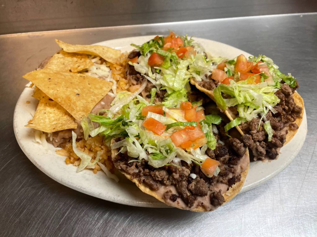Steak tostada dinner with rice and beans
